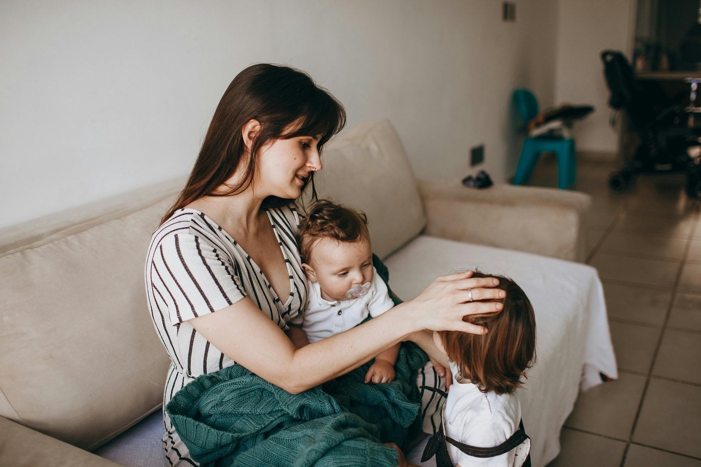 Mother with young children enjoying time together at home