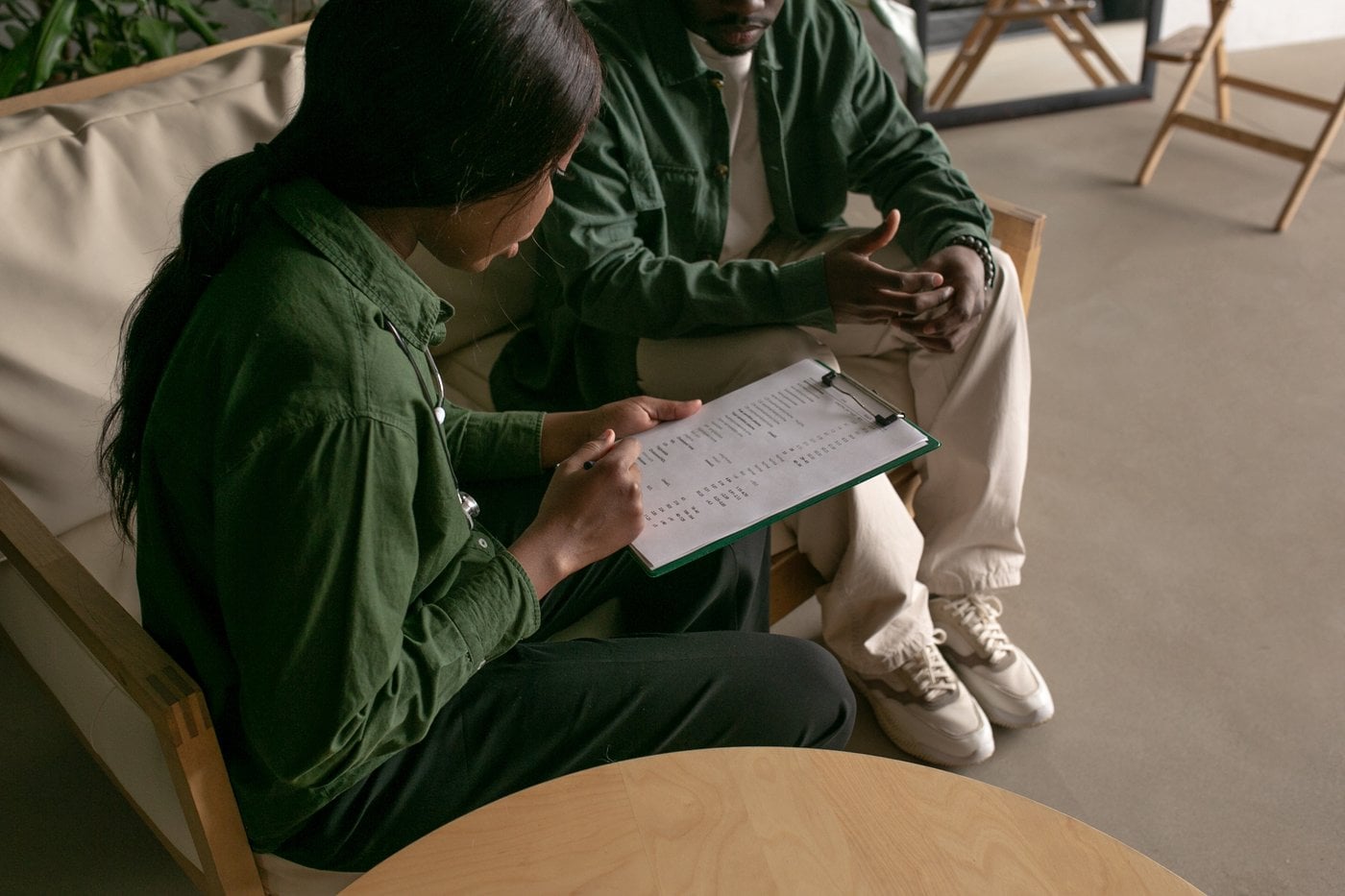 Two people reviewing NDIS plan documents together